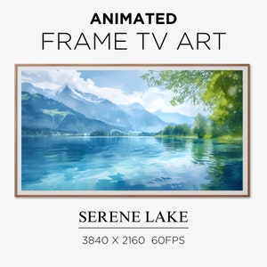 May include: Animated TV art featuring a serene lake scene with mountains in the background. The lake is a vibrant blue with a reflection of the mountains and trees. The sky is a light blue with white clouds. The image is 3840 x 2160 pixels and runs at 60 frames per second.
