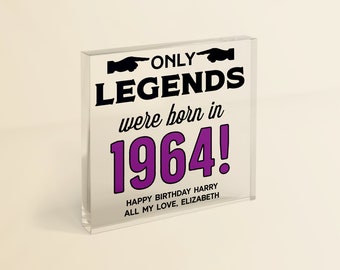 May include: A clear acrylic block with black text that reads "ONLY LEGENDS were born in 1964!" in a purple font. The text "HAPPY BIRTHDAY HARRY ALL MY LOVE, ELIZABETH" is printed below in black.