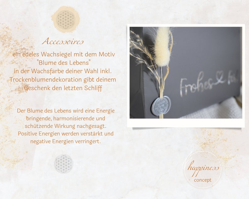 May include: A gray box with a wax seal and a dried flower arrangement. The box has the text "Frohes &" written on it. The wax seal has a flower design. The dried flower arrangement is a white fluffy flower with brown stems. The box is on a white surface. The text "happiness concept" is on a clear circle on the bottom right of the image.