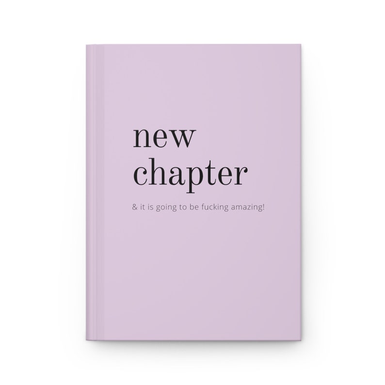 May include: A lavender-colored book with the text "new chapter & it is going to be fucking amazing!" printed in black.