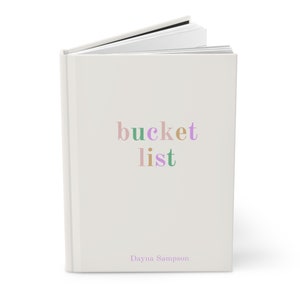 May include: A white book with the text "bucket list" in colorful letters and the author's name "Dayna Sampson" at the bottom.