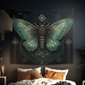 May include: A tapestry featuring a large, intricately detailed, green and blue moth with a geometric pattern in the background. The tapestry is hanging on a dark wall above a bed with brown and black pillows.