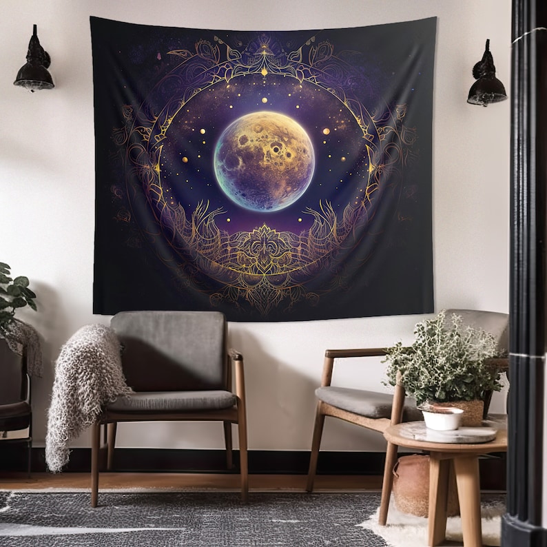 May include: A tapestry featuring a large, full moon in a golden mandala design against a dark blue background with stars. The moon has a textured surface and a purple glow.