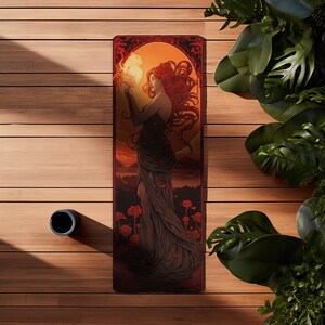 May include: A yoga mat with a vintage art nouveau design featuring a woman with red hair holding a flame in a dark dress against a sunset background.