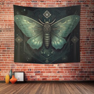 May include: A tapestry featuring a large, intricately detailed, green moth with a dark background. The moth is surrounded by a geometric pattern with a star-like design in the center.