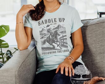 Saddle Up We Are Following Jesus Christian Womens Tshirt Vintage Western Shirt for Her Cute Trendy Christian Tee Following Jesus Western Tee