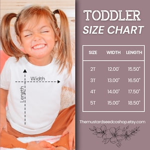 May include: A size chart for toddler clothing with measurements in inches. The chart shows the width and length of shirts in sizes 2T, 3T, 4T, and 5T. The chart is on a pink background with a floral design at the bottom.