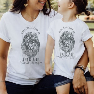 May include: White t-shirts with a lion graphic and the text "Hail, Hail Lion of Judah, Let the Lion Roar".
