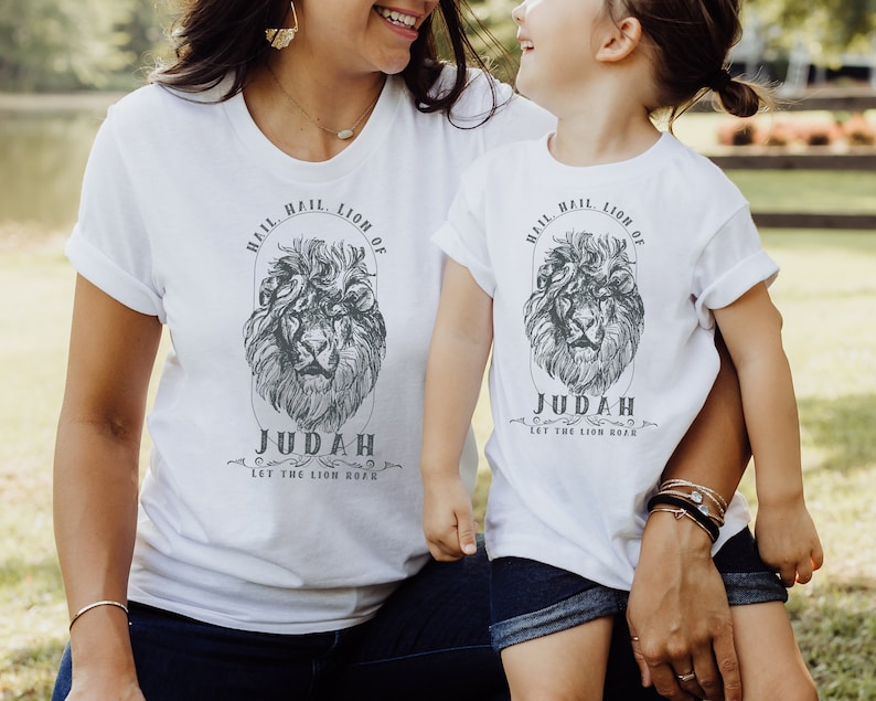 May include: White t-shirts with a lion graphic and the text "Hail, Hail Lion of Judah, Let the Lion Roar".