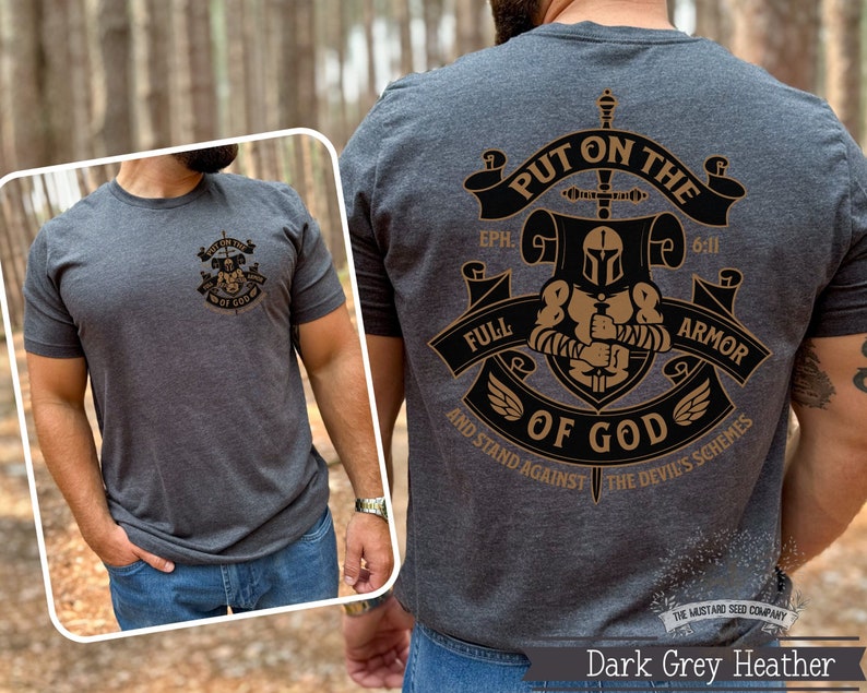 May include: Dark grey heather t-shirt with a graphic design of a knight in armor holding a sword. The graphic includes the text "Put on the Full Armor of God" and the scripture reference "Eph. 6:11".