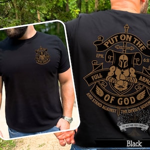 May include: Black t-shirt with a gold graphic of a knight in armor with the text "Put on the Full Armor of God" and the scripture reference "Eph. 6:11". The graphic also includes the text "And Stand Against the Devil's Schemes".