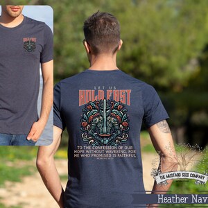 May include: Heather navy blue t-shirt with a graphic of a knight holding a sword and the text "Let us hold fast to the confession of our hope without wavering, for he who promised is faithful. Hebrews 10:23". The Mustard Seed Company logo is in the bottom right corner.