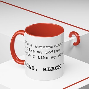 May include: White ceramic mug with a red interior and handle. The mug features the text "I'm a screenwriter I like my coffee Like I Like my slug BOLD. BLACK." A coffee mug for writers.