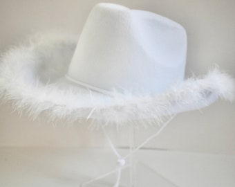May include: A white cowboy hat with a fluffy white feather trim.