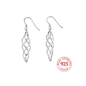 May include: Silver dangle earrings with a twisted, cage-like design. The earrings are marked "Real Sterling 925 Silver".
