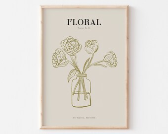 May include: A framed print with a beige background featuring a line drawing of a bouquet of flowers in a glass vase. The text "FLORAL" is at the top of the print, and "Art Gallery, Amsterdam" is at the bottom.