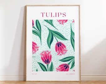 May include: A framed art print featuring a floral design of pink tulips with green leaves against a light blue dotted background. The word "TULIPS" is printed in pink at the top, with "NO.15" and "LE JARDIN" at the bottom.