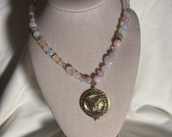 Magnifying glass with beaded necklace