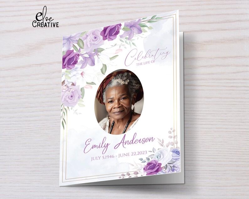 May include: A purple and white floral funeral card with a photo of a woman in a white shirt and a necklace. The card reads "Celebrating the life of Emily Anderson July 5, 1946 - June 22, 2023".