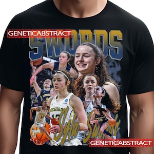 May include: Black t-shirt featuring a collage of a basketball player, with the name "Syla Swords" in gold and blue. The shirt also includes the text "SWORDS" in large, stylized letters and the brand name "GENETICABSTRACT".