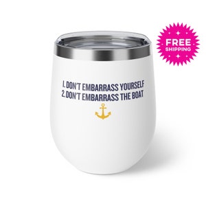 May include: White stainless steel wine tumbler with a navy blue inscription that reads "1. Don't embarrass yourself 2. Don't embarrass the boat" and a gold anchor symbol.