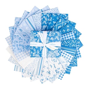 May include: A collection of blue and white fabric squares arranged in a circular pattern. The fabrics feature various patterns, including floral, bow, and gingham designs. A square bundle is tied with a white ribbon, and the fabrics are suitable for quilting or crafting.