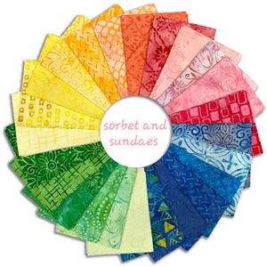 May include: A circular arrangement of colorful fabric squares in shades of yellow, orange, pink, red, green, and blue. The fabric has various patterns. The text "sorbet and sundaes" is in the center.