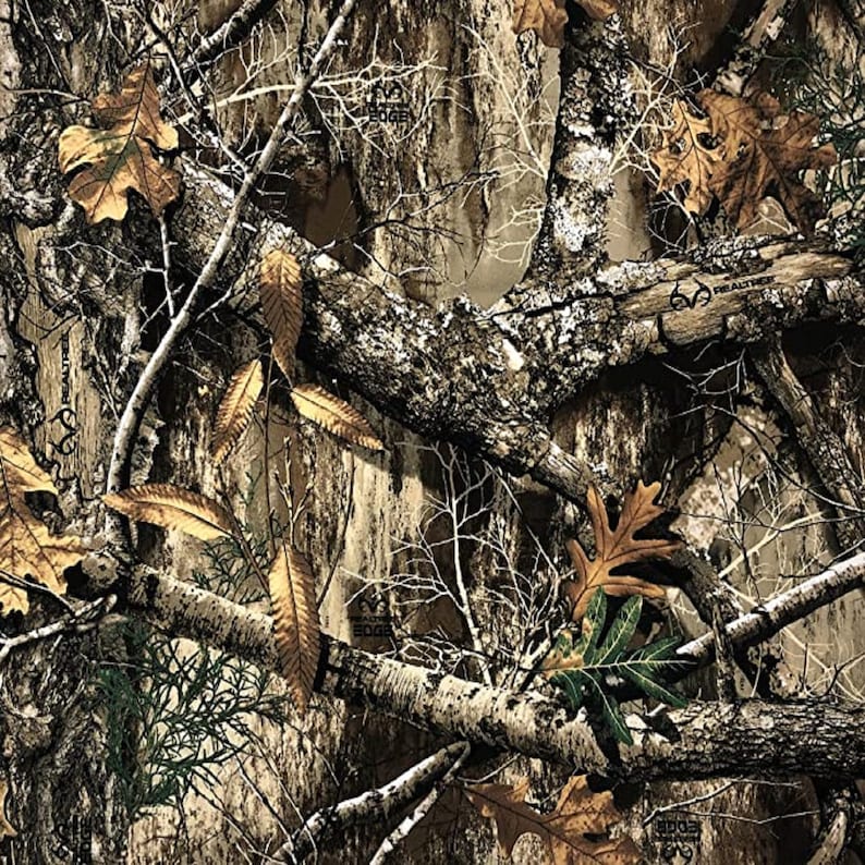 May include: Camouflage pattern featuring brown, white, and green colors. The pattern includes branches, leaves, and tree bark.