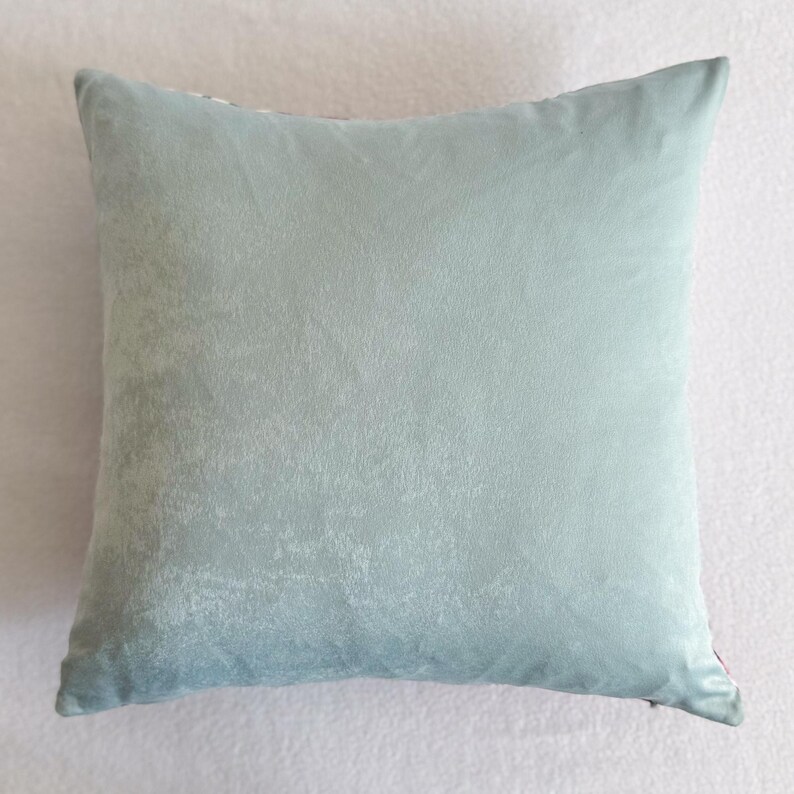 May include: A light blue cushion with a soft, textured fabric.