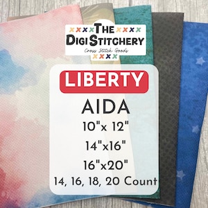 May include: A collection of Aida cross stitch fabric sheets in various colors and patterns, including watercolor, teal, black, and blue with stars. Text reads The Digi Stitchery, Liberty Aida, 10x12, 14x16, 16x20, and 14, 16, 18, 20 Count.