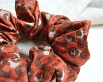Handmade scrunchie hair tie, brown red-orange-beige with leopard / leo pattern on it, made of real cotton 100%