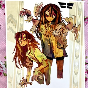 May include: A digital art print featuring two stylized figures with long brown hair. One figure has multiple eyes and a yellow shirt, while the other holds a book titled The Wisdom Within. A bird-like creature is depicted above the figures.