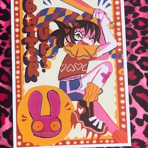 May include: Art print featuring a cartoon illustration of a girl swinging a baseball bat, with the word "Batter" above her. The print has a pink, orange, and blue color scheme, with a cartoon rabbit in the lower left corner.