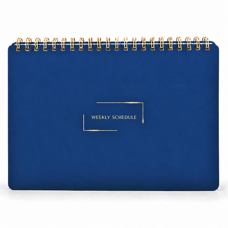 May include: A dark blue weekly schedule planner with a gold wire spiral binding at the top. The front cover features the text "WEEKLY SCHEDULE" printed in gold, centered within a thin gold rectangular frame design.