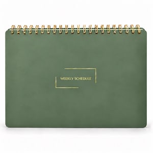 May include: A sage green weekly schedule planner with a gold wire spiral binding at the top. The front cover features the text WEEKLY SCHEDULE in gold lettering, enclosed within a thin gold rectangular frame design on the center.