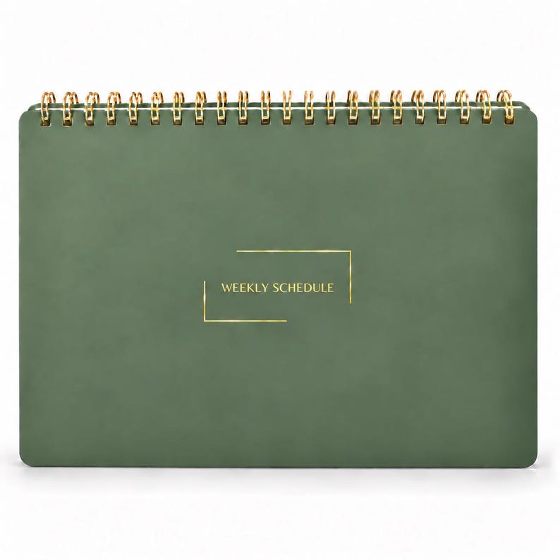 May include: A sage green weekly schedule planner with a gold wire spiral binding at the top. The front cover features the text WEEKLY SCHEDULE in gold lettering, enclosed within a thin gold rectangular frame design on the center.