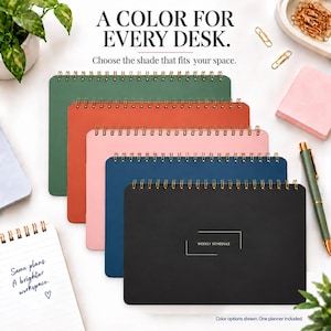 May include: A stack of five spiral-bound planners in green, orange, pink, blue, and black. The black planner features the text WEEKLY SCHEDULE. The image includes the text A COLOR FOR EVERY DESK. Choose the shade that fits your space.