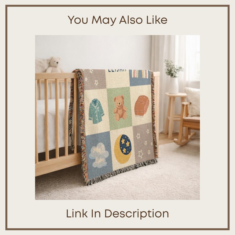 May include: A woven baby blanket with a patchwork design featuring a teddy bear, moon, stars, and other baby-themed illustrations. The blanket is draped over a wooden crib. The text "You May Also Like" and "Link In Description" are visible.