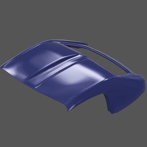 May include: A blue car part, possibly a convertible top, with a smooth, glossy finish. The part has a curved shape and a raised center section.