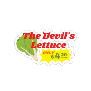 May include: A sticker featuring a cartoon image of a green lettuce with the text "The Devil's Lettuce" in red and "ONLY £4.20 PER GRAM" in yellow.