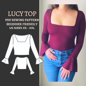 May include: A burgundy long-sleeve top with a square neckline and flared sleeves. The top is paired with blue jeans. The image also includes a white illustration of the "LUCY TOP" sewing pattern, labeled as beginner-friendly, in US sizes XS-XXL.