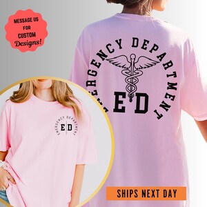 a woman wearing a pink t - shirt with a cadus on it