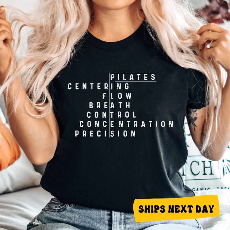 a woman wearing a black shirt with white writing on it