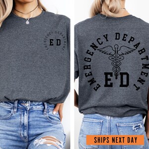 a woman wearing a grey shirt with the words emergency dept on it