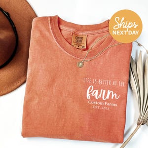 a t - shirt that says live is better at the farm