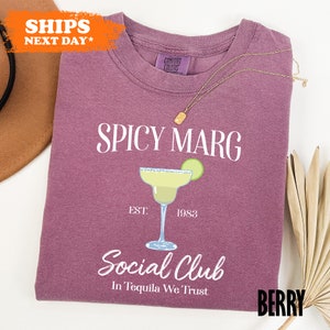 a t - shirt with a picture of a cocktail on it