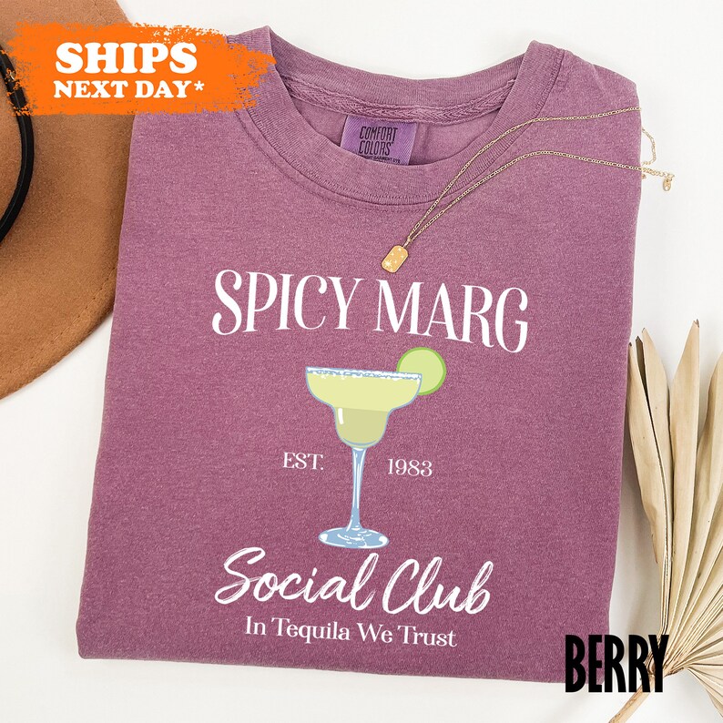 a t - shirt with a picture of a cocktail on it