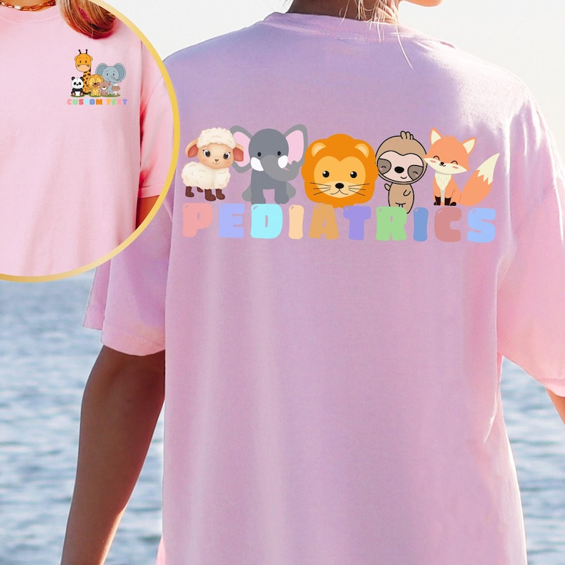 a person wearing a pink shirt with animals on it