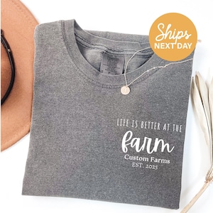 a t - shirt with the words life is better at the farm on it
