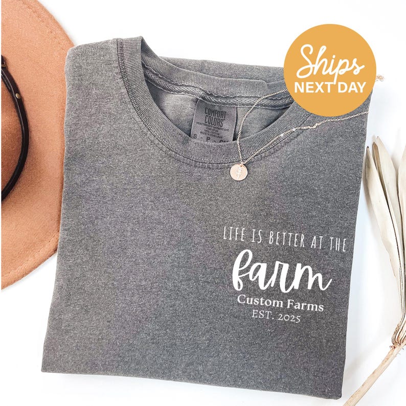 a t - shirt with the words life is better at the farm on it